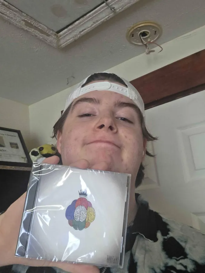 Fan holding the CD