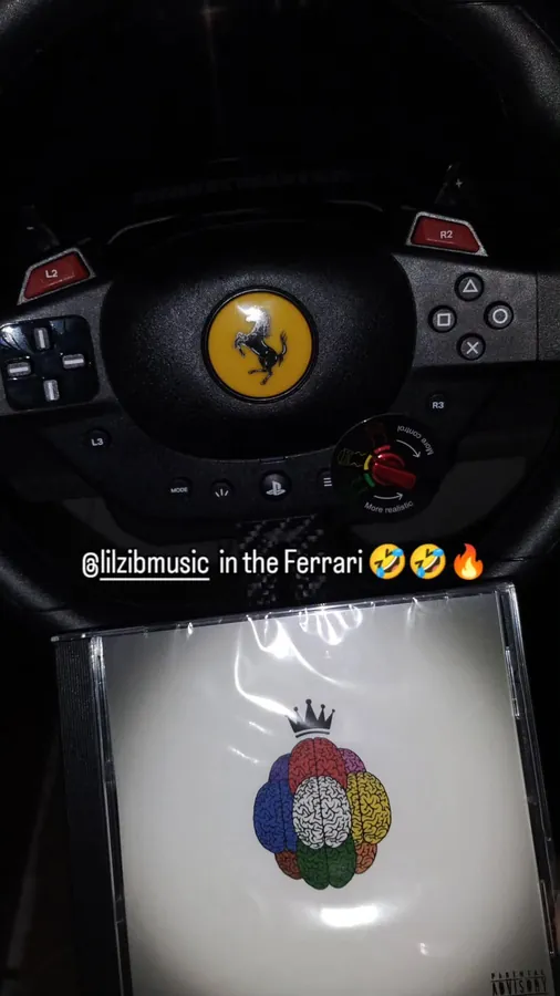 The CD propped on a racing wheel